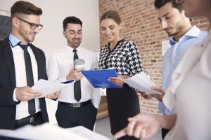 People from the company over some documents